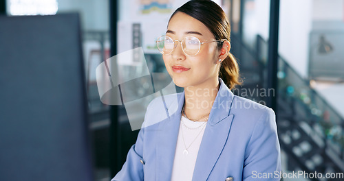 Image of Computer, office and Asian business woman with glasses typing and planning a corporate project. Success, professional and professional employee working on a company report, document or proposal on pc