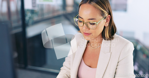 Image of Asian woman, business or computer planning, typing or digital marketing research, data analytics or creative strategy in advertising agency. Happy worker working on desktop pc in trendy modern office