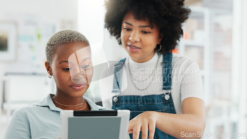 Image of Tablet, teamwork and collaboration with a woman designer and her creative assistant talking about an idea in the office. Internet, technology and design with a female employee and a colleague at work