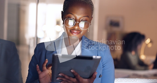 Image of Black woman, tablet and business in office at night working overtime, corporate deadline or online research. Social media, internet surfing and female from Nigeria on digital tech in dark office.