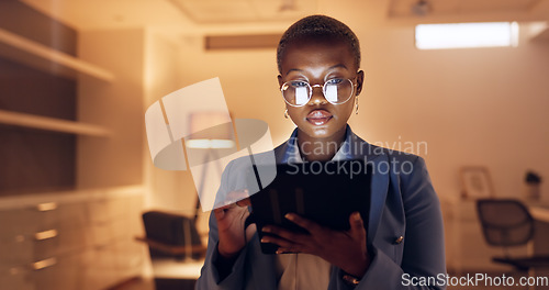 Image of Tablet, night reading business woman with glasses for social media marketing, digital analytics or website review in office. Manager, entrepreneur or black woman check online international b2b email