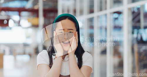 Image of Wow, surprise and excited with a business asian woman looking shocked by putting her hands on her face in expression. Portrait, emoji or motivation with a female employee feeling shock frim good news