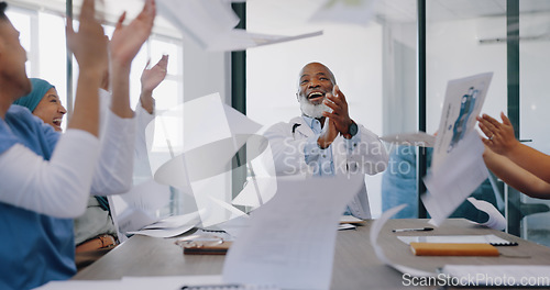 Image of High five, applause and doctors throw paper in celebration of goals, targets or achievements. Meeting, teamwork and group of people or nurses throwing documents and clapping to celebrate success.