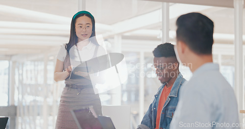 Image of Asian business woman, tablet or mentor in digital marketing company, advertising coworking space or branding education. Creative designer, speaker or team work meeting diversity with kpi technology