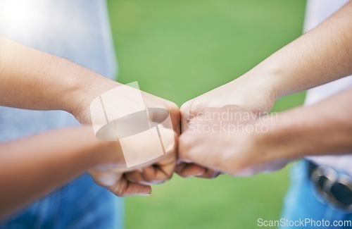 Image of People, hands and fist bump for community, trust or collaboration in partnership together in the outdoors. Hand of team bumping fists in unity for agreement, coordination or support in solidarity