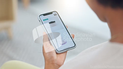 Image of Shopping online and scrolling through makeup products to find a sale or discount. Hands of a woman browsing cosmetics on her phone from above. Enjoying the convenience and ease of purchasing apps