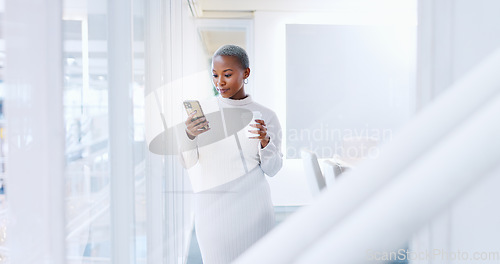 Image of Black woman, phone and laughing for social media, communication or texting at the corporate office. African American female business woman smiling with mobile smartphone and chatting at the workplace