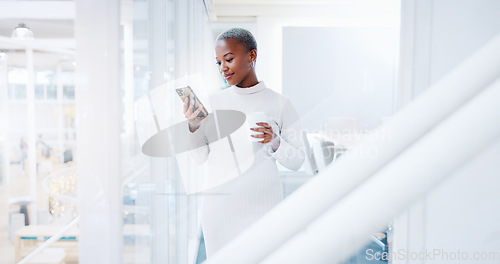 Image of Black woman, phone and laughing for social media, communication or texting at the corporate office. African American female business woman smiling with mobile smartphone and chatting at the workplace