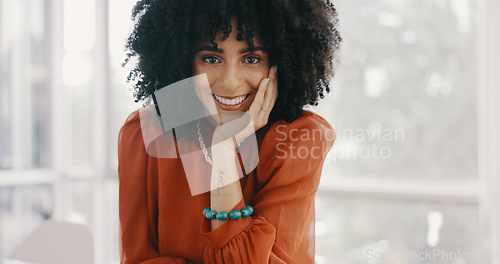 Image of Face, vision and mindset with a business black woman sitting at a desk with her hand on her chin. Portrait, happy and smile with a female employee thinking about future growth or company development