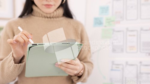 Image of Woman, tablet and ui ux design with the developer being creative for mobile app project with a pen in office. Female planning, web design and development of wireframe on storyboard for website idea