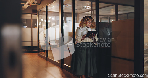 Image of Tablet, working and hallway woman typing feedback review of social media website, online news article or blog post. Late night, diversity and ceo hello to African girl using cloud computing database