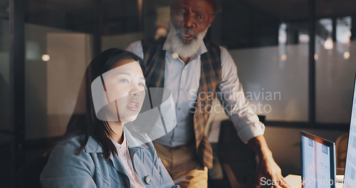 Image of Office, overtime and woman with manager at computer, coaching for worker on online project for digital marketing company. Teamwork, advice and support from management for girl working late at night.