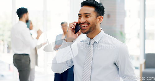 Image of Businessman, communication and phone call with mobile networking at financial advisory startup company. Conversation, b2b and business man consulting on smartphone, talking and standing in office.