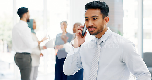 Image of Businessman, communication and phone call with mobile networking at financial advisory startup company. Conversation, b2b and business man consulting on smartphone, talking and standing in office.