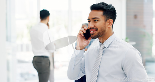 Image of Businessman, communication and phone call with mobile networking at financial advisory startup company. Conversation, b2b and business man consulting on smartphone, talking and standing in office.