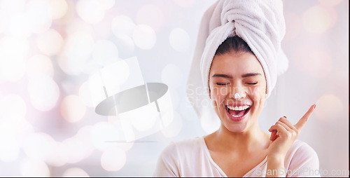 Image of Woman, face cream and mockup banner, bokeh background and advertising skincare product for wellness. Happy female, towel and facial lotion for aesthetic makeup, beauty or salon smile on mock up space