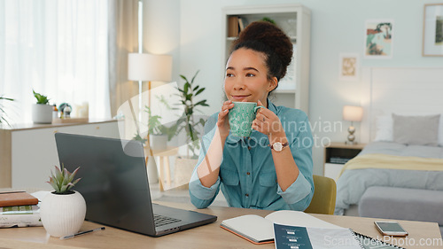 Image of Woman, coffee and remote work from home consultant enjoy cup of tea, beverage and drink in house, apartment and room. Happy girl, freelancer and drinking coffee while working on laptop blog online