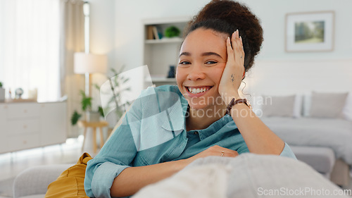 Image of Woman, sofa and face with smile, thinking and happy idea in home, living room or apartment. Black woman, couch and relax in lounge, house and daydream with vision, goal or happiness in Los Angeles