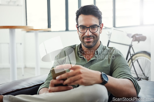 Image of Creative businessman, phone and smile for social media, communication or advertising at office. Portrait of happy employee man smiling with smartphone in networking or online conversation for startup