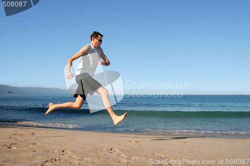 Image of man running on the beach