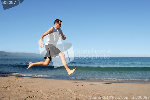 Image of man running on the beach