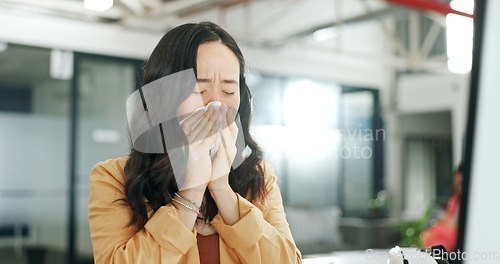 Image of Blowing nose, tissue and woman sick with flu, cold or covid virus infection while working on creative ux web design. Medical healthcare, sneeze and Asian employee ill with winter sickness or allergy