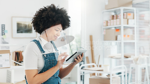 Image of Black woman, online shopping and tablet at warehouse office scroll for free shipping order delivery shipment information. African girl worker, logistics and tech working for internet ecommerce shop