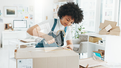 Image of Woman packing box, package and cargo with tape for delivery, sale and shipping in workshop, startup store and creative studio. Female small business owner prepare product, order and service logistics