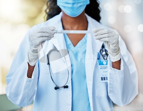 Image of Woman, doctor and hands with test tube, mask and gloves holding covid, flu or DNA sample. Hand of female medical expert with long testing case for examination or experiment in cure for illness