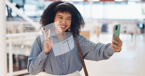 Image of Black woman influencer, selfie and peace sign with smile, smartphone or walking in urban shopping mall. Happy, phone and woman with hand gesture for social media, web or online app at mall in Atlanta