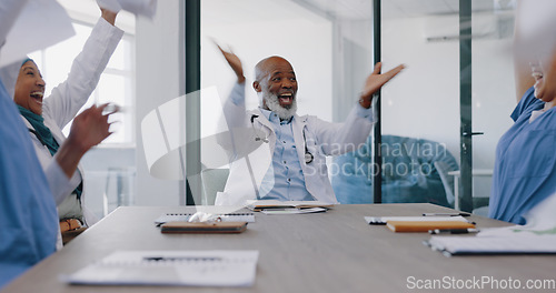 Image of Doctors, applause and high five with success and paper confetti, celebrate win in health and cheers for team building. Happy, medical innovation win and target goal with motivation and diversity.