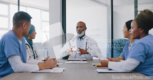 Image of Mature doctors, nurses or teamwork meeting in hospital planning, medical surgery ideas or medicine treatment strategy. Talking healthcare workers, men or women with paper documents in collaboration