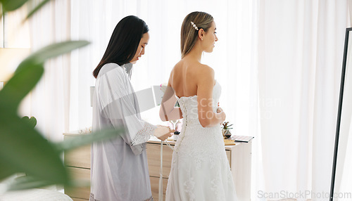 Image of Happy bride in wedding dress, friends helping with knot on luxury corset back string and young women together in home. Asian woman supporting hug, marriage ready preparation and bridesmaid happiness