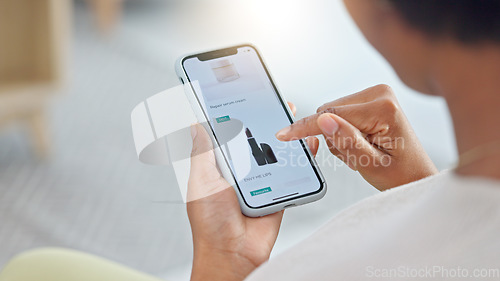 Image of Shopping online and scrolling through makeup products to find a sale or discount. Hands of a woman browsing cosmetics on her phone from above. Enjoying the convenience and ease of purchasing apps