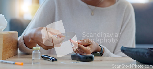 Image of Woman with syringe preparing an insulin injection at home with an online tutorial. One girl injecting self with medicine treatment to treat chronic illnesses type 1 2 diabetes, high blood or glycemia