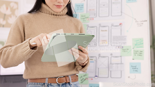 Image of Woman, tablet and ui ux design with the developer being creative for mobile app project with a pen in office. Female planning, web design and development of wireframe on storyboard for website idea