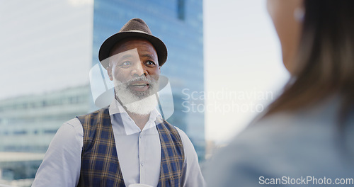 Image of City, black man and woman on rooftop networking, talking or speaking of goals, project development or vision. Team building, relaxing or senior businessman in conversation, communication or chatting