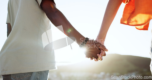 Image of Interracial couple, bonding or holding hands in support, trust or security in Lisbon city, Portugal. Zoom, black man or woman in solidarity, love or unity on summer holiday vacation in relax location