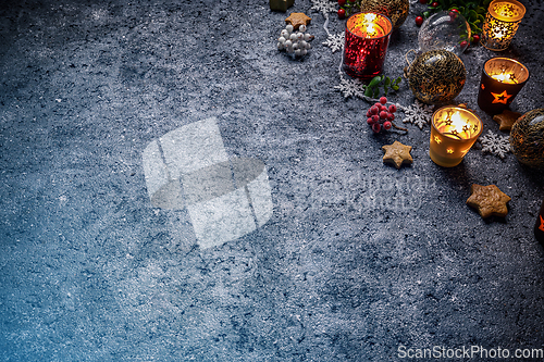 Image of Christmas candle, berries and gingerbread