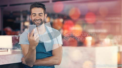 Image of Small business, coffee shop and man with phone, mockup and confident smile in restaurant, startup pub with mobile app. Success, happy manager or cafe barista with smartphone, apron and service job.