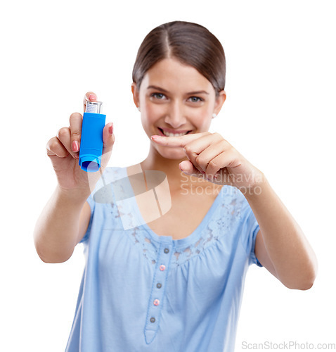 Image of Woman, asthma pump and smile pointing inhaler for medical solution, respiratory or breathing against white studio background. Portrait of isolated female holding puffer to breathe, allergy or relief