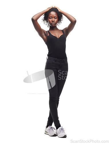 Image of Fashion, beauty and portrait of a black woman in a studio with a casual outfit, confidence and natural pose. Beauty, young and African female model with afro posing while isolated by white background