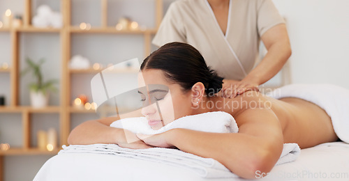 Image of Spa massage, zen and relax customer at beauty salon for body wellness support, chakra energy healing and luxury healthcare. Masseuse woman, calm mindset and peace for client with candle aromatherapy