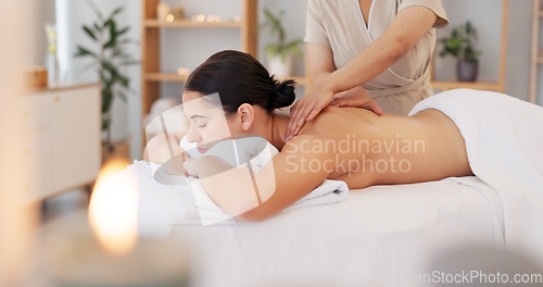 Image of Spa wellness, massage and relax customer at luxury beauty salon for body healthcare, candle aromatherapy or masseuse support. Zen peace, calm mindset or chakra energy healing for healthy client woman