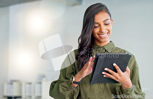 Image of Business woman typing an email, browsing the internet and searching for ideas on a tablet at work. Female corporate professional, expert and designer scrolling on social media or reading a blog