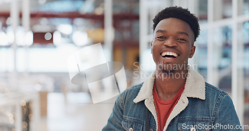 Image of Black man, face and smile portrait in building for designer success, positive mindset and employee standing in lobby. African man, portrait and happy for innovation vision or entrepreneur headshot