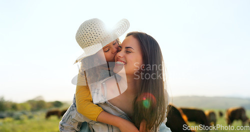 Image of Mother, child on farm, hug and bonding in the countryside, together farming, mom piggy back kid with fun outdoor in nature. Happy, woman and girl, agriculture and field, sustainability and cattle.