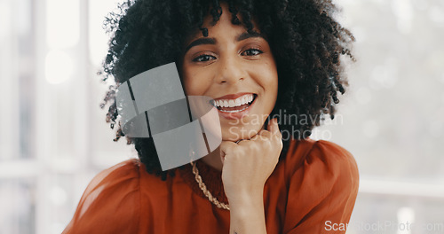 Image of Face, vision and mindset with a business black woman sitting at a desk with her hand on her chin. Portrait, happy and smile with a female employee thinking about future growth or company development