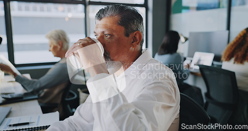 Image of Coffee, office and senior businessman working on a project and doing corporate research on internet. Professional, computer and senior male manager drinking warm beverage and typing management report