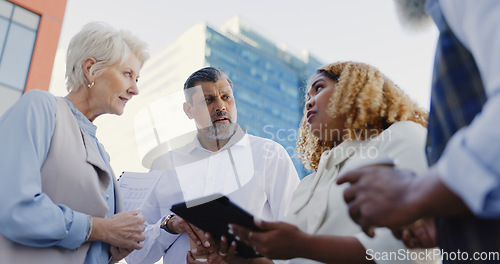 Image of Leadership, senior or business people networking on rooftop in city talking or planning a digital marketing strategy. Teamwork, CEO or employees in meeting speaking of kpi goals or sales growth ideas